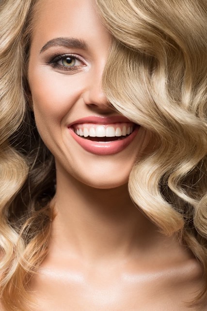 blonde-woman-with-invsialign-clear-aligners-in-santa-clarita